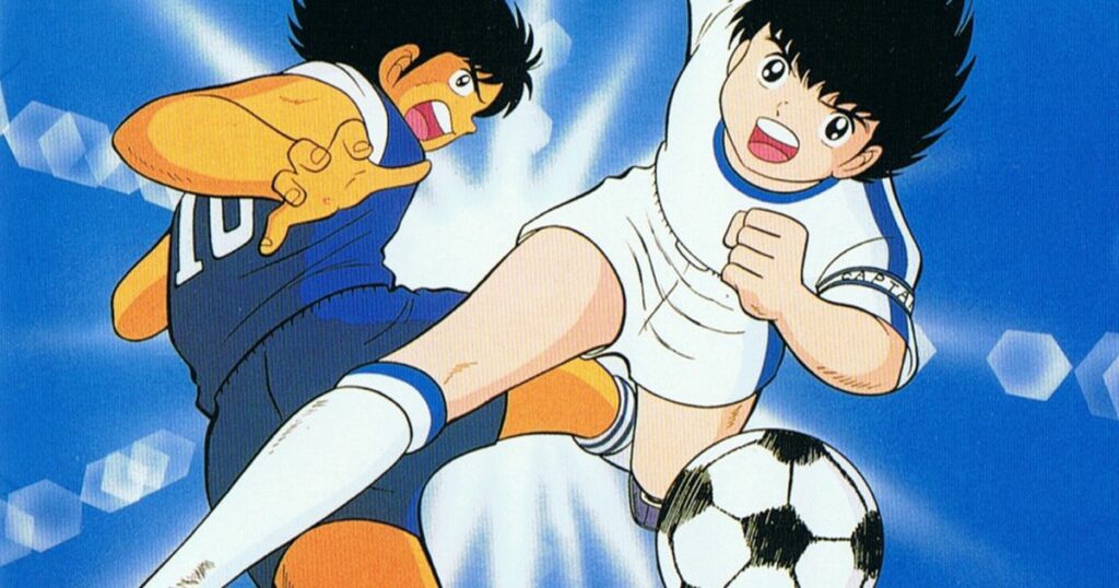 Oliver Atom, personaje principal de los Supercampeones, junto a Steve Hyuga disputando una pelota de fútbol.